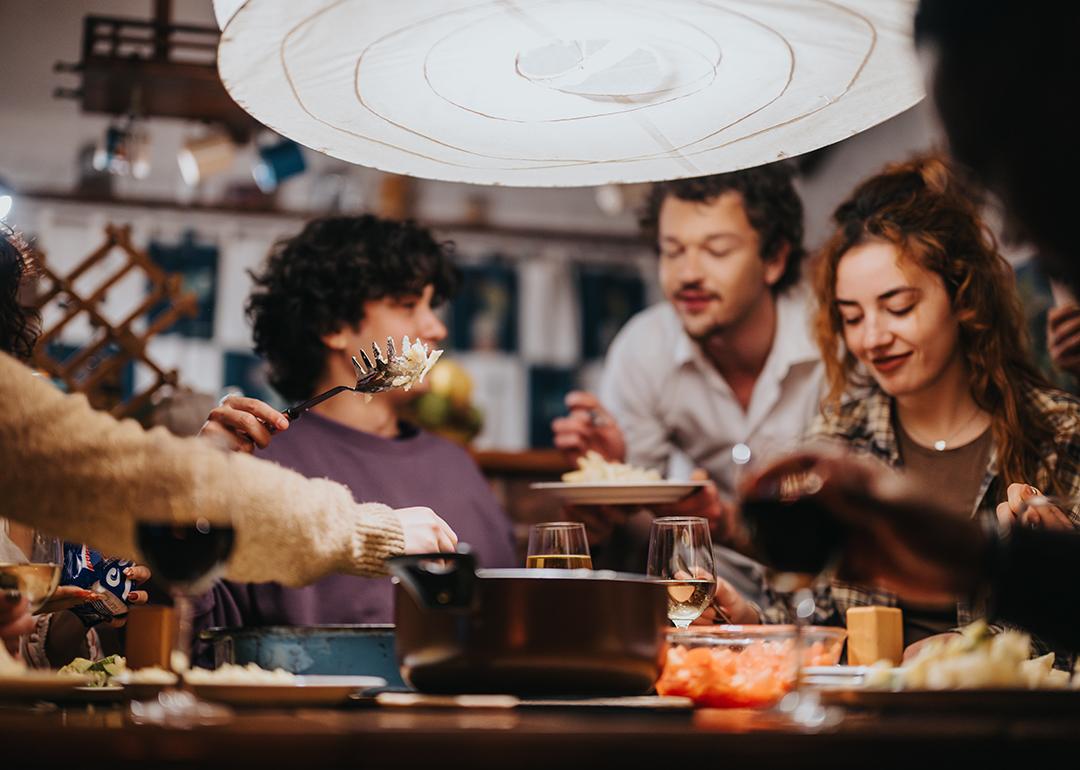 A group of friends having a dinner party.