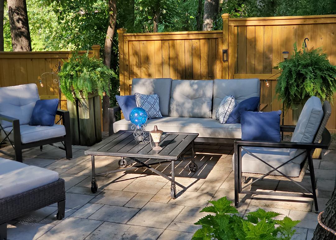A patio with modern furniture during the afternoon.