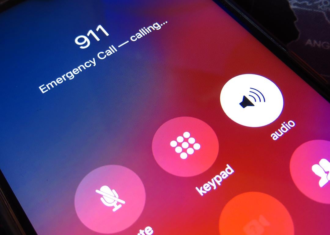 Emergency call to 911 on a smartphone screen.