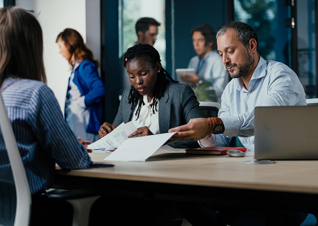 A small diverse business team project planning in a modern office.