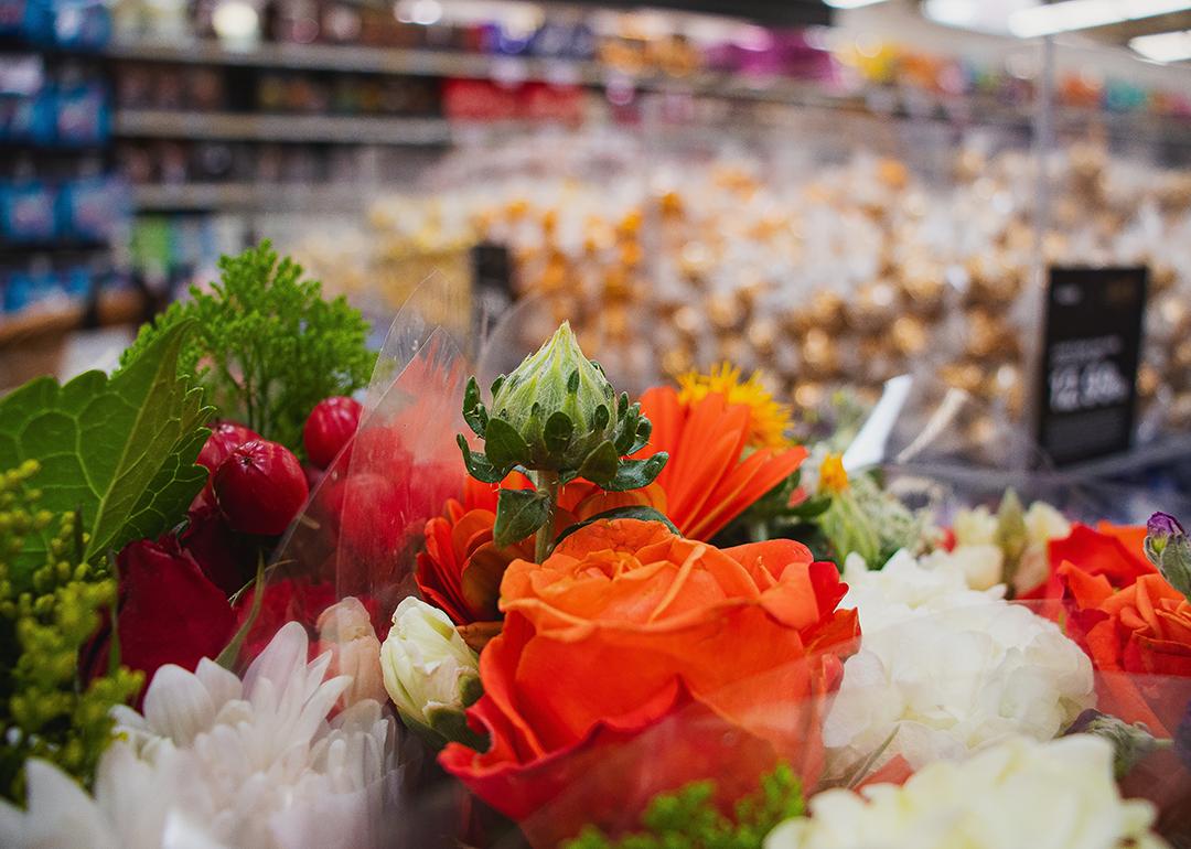 A close up on flowers for sale at the grocery store.