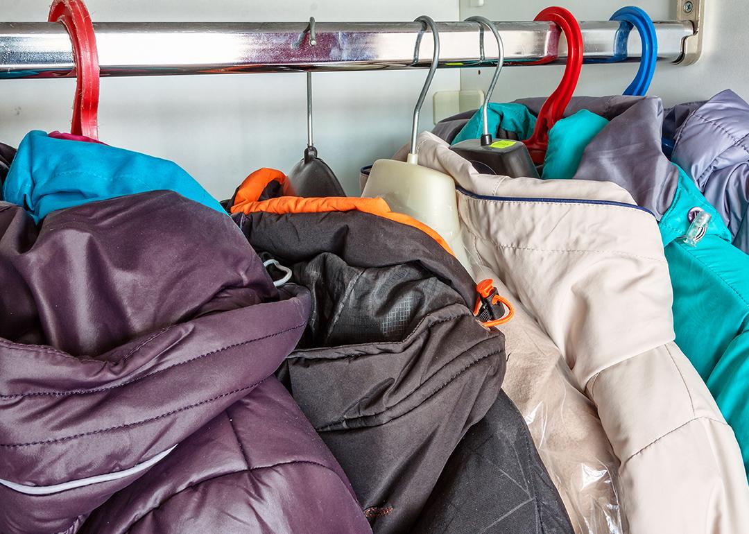 Winter jackets in a closet hanger.