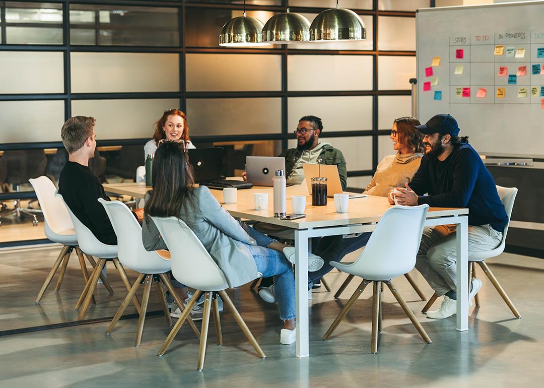 A business team brainstorming in a modern office.