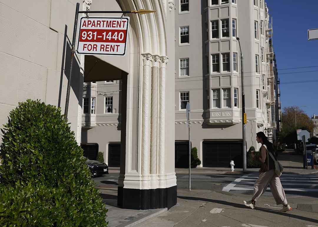 An apartment for rent sign hangs outside of an apartment building in San Francisco, California.