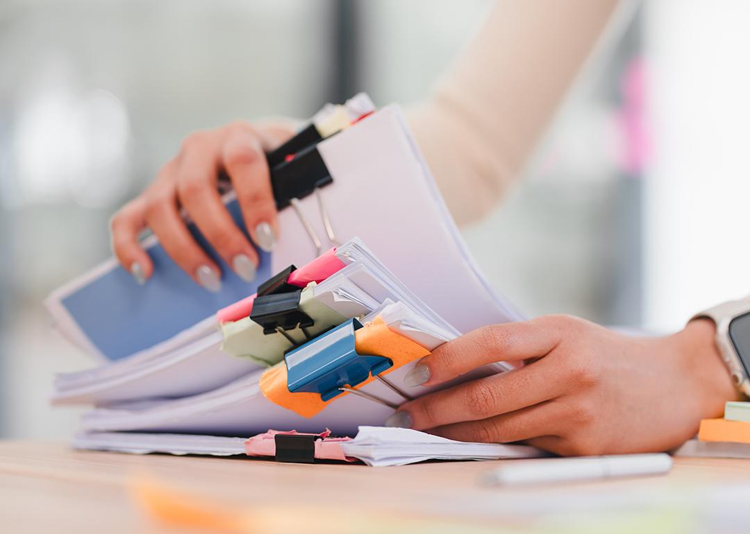 Person organizing sets of documents.