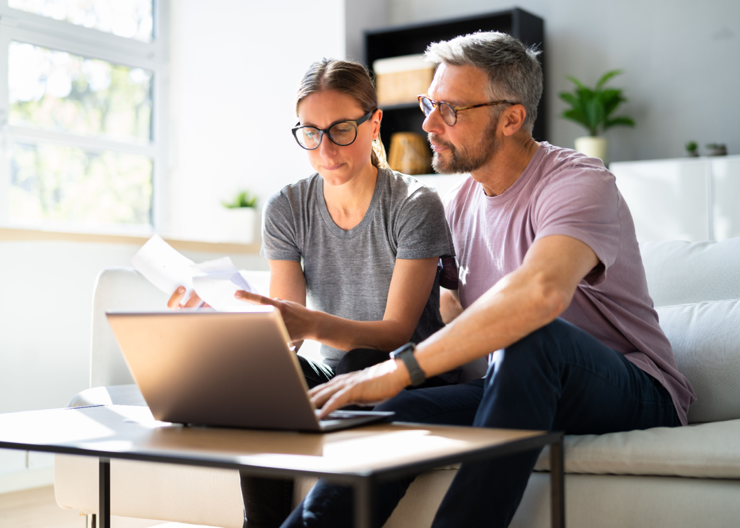 Couple doing taxes on a computer.