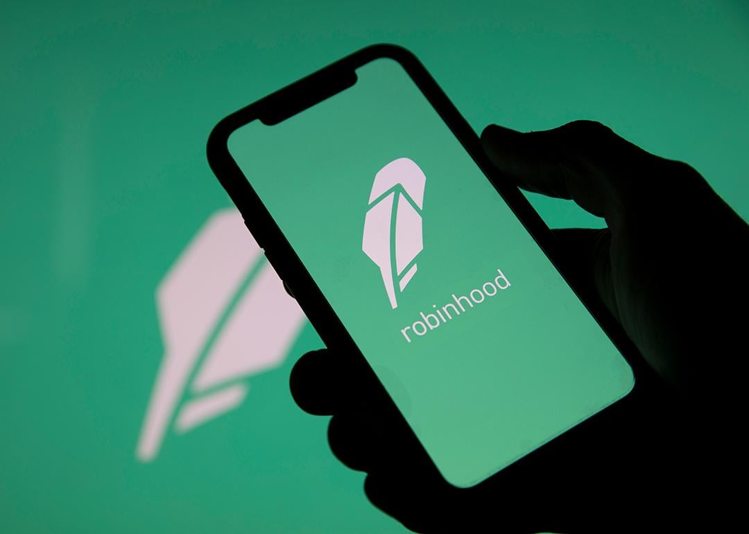 Robinhood, a financial investing app, and its logo displayed on a smartphone.