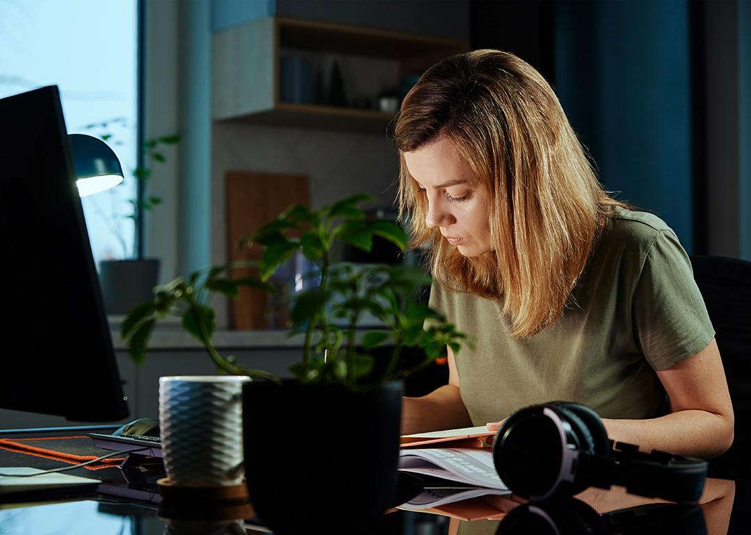A woman busy working from home.