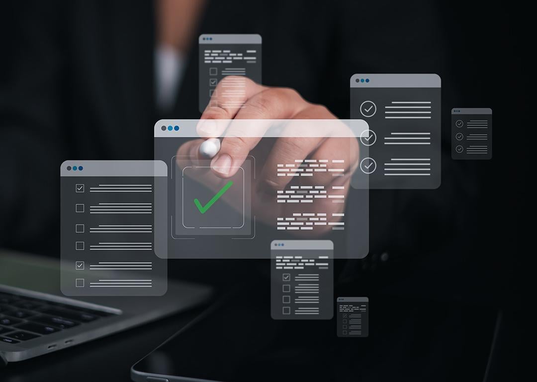 A person using a laptop which shows a checklist and filling survey forms online.