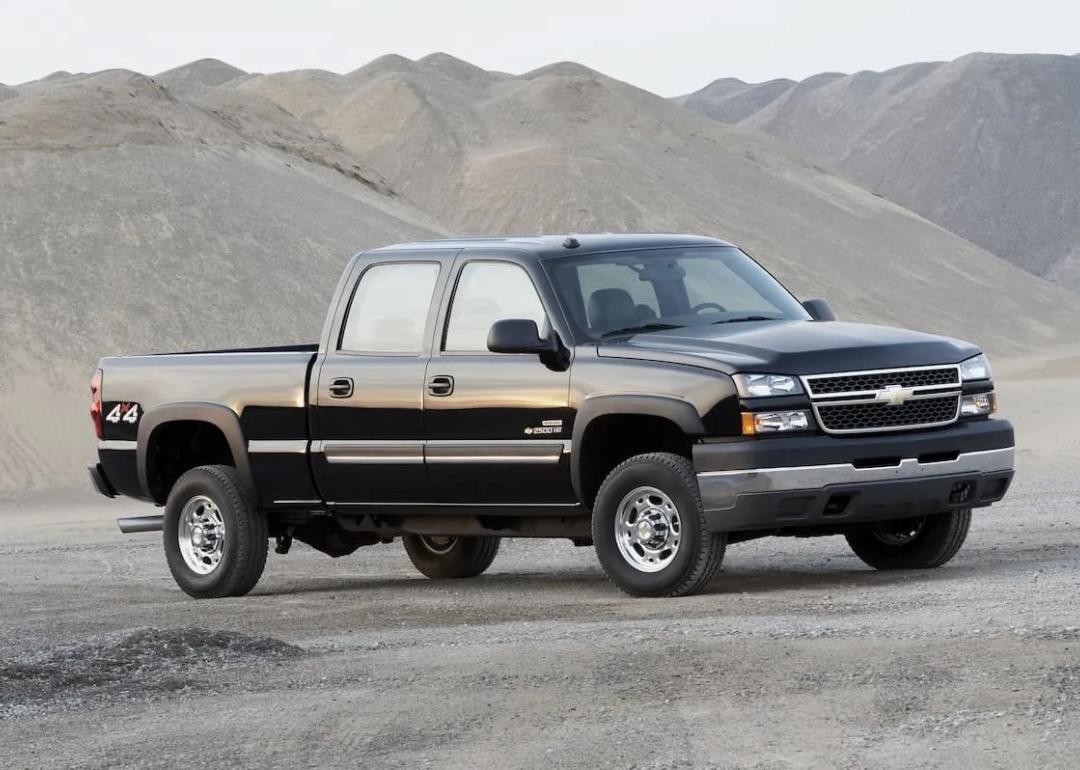 2006–2007 Black Chevrolet Silverado/GMC Sierra 2500HD/3500HD (6.6-liter Duramax LBZ) parked on rocky sand.