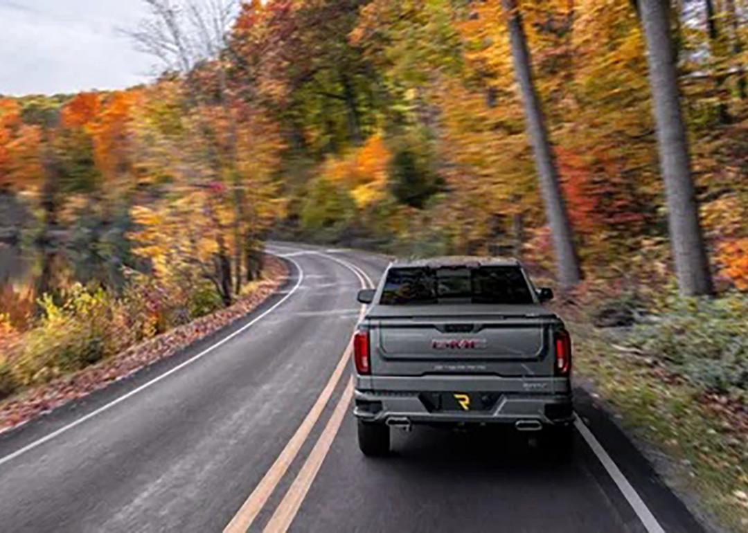 A truck driving down a highway.