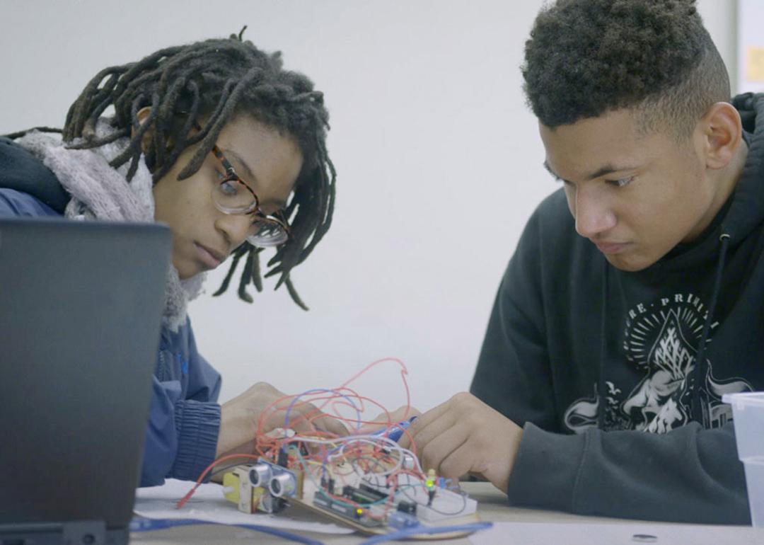 Students at Latitude High School in Oakland, CA collaborate on designing an autonomous vehicle to aid senior citizens.