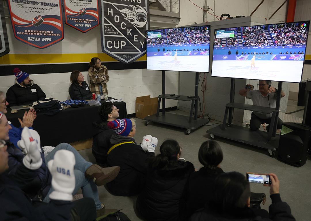 Community members watch local skater Alysa Liu compete in the Milano Cortina 2026 Winter Olympic games during a watch party at the Oakland Ice Center in Oakland, California on Thursday, Feb. 19, 2026
