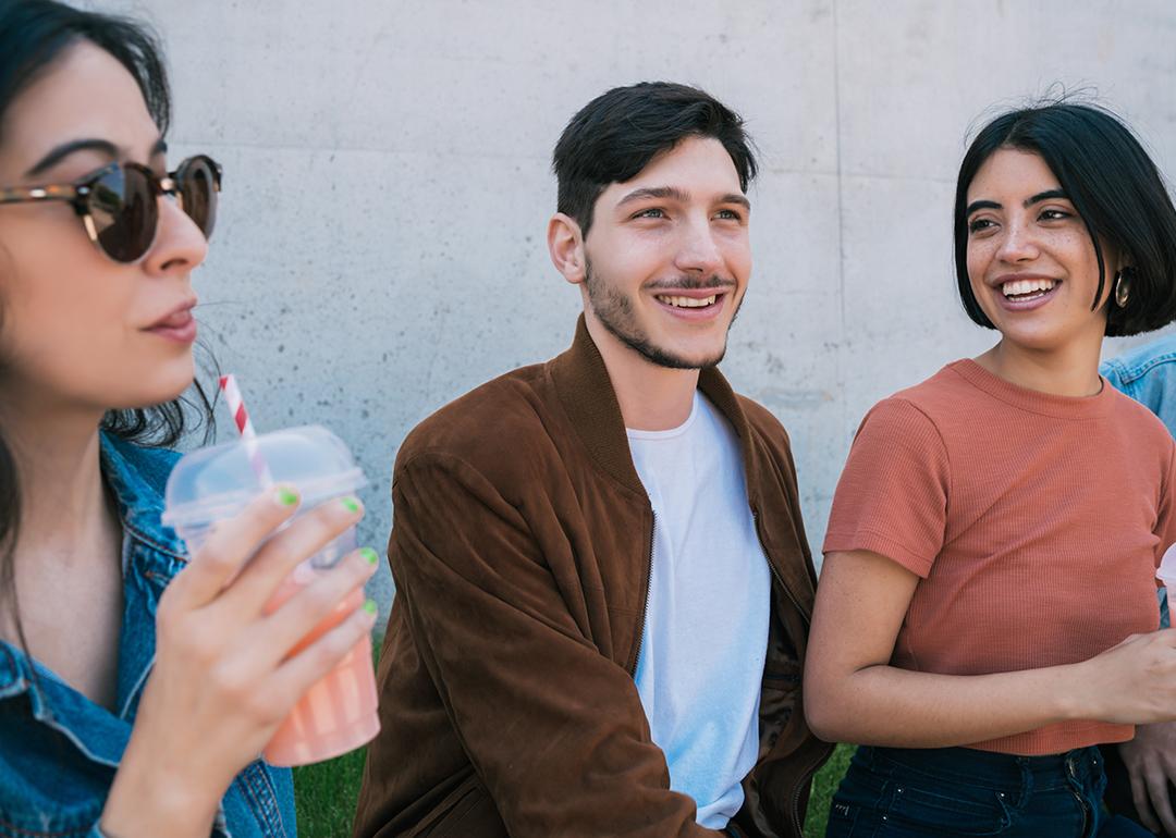 A group of friends having fun together over drinks. 