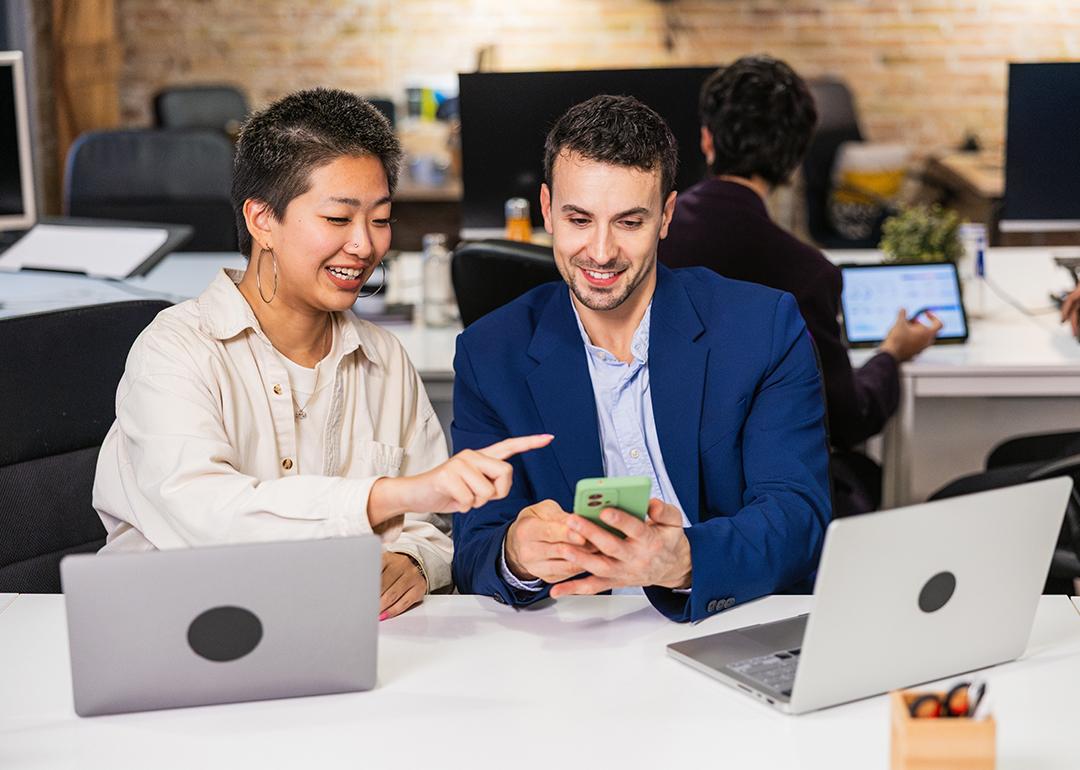 A diverse business team working together on a project in an office.
