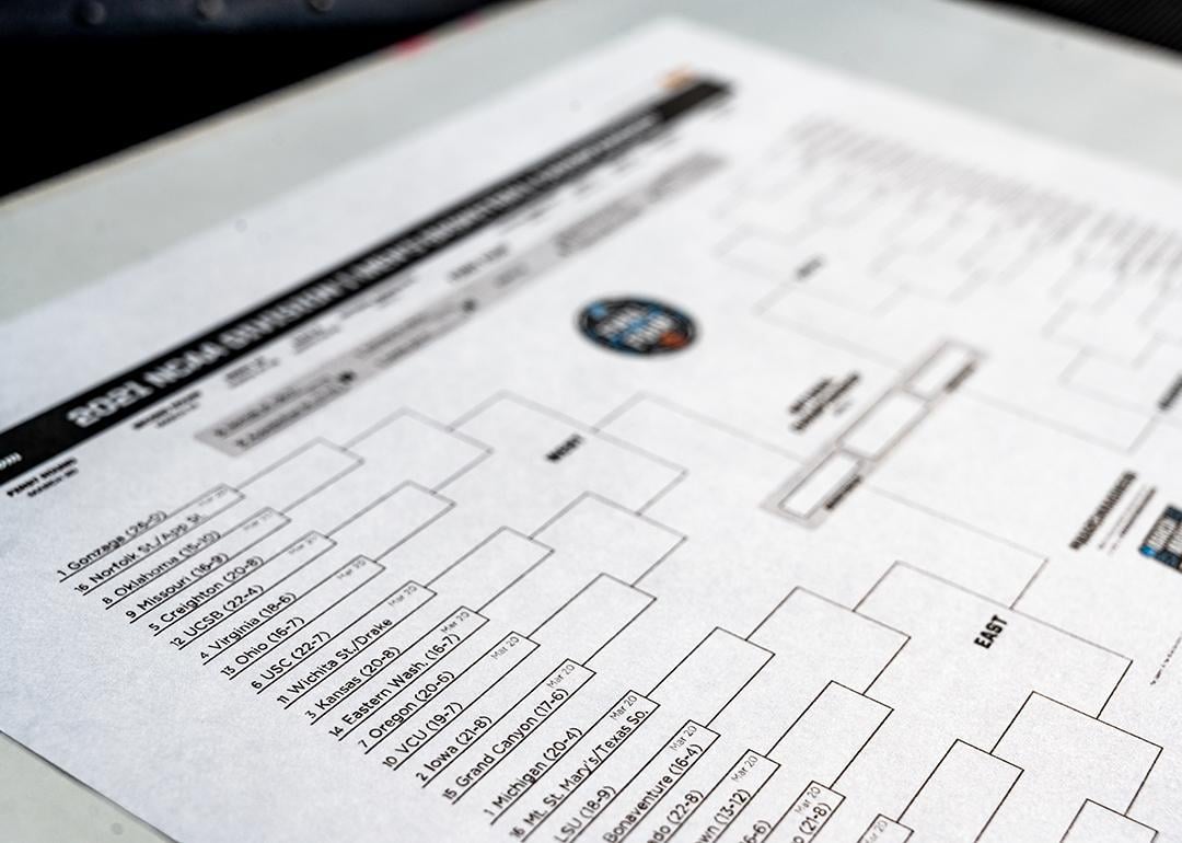 A selective focus shot on the Western Region part of a printed NCAA tournament bracket.