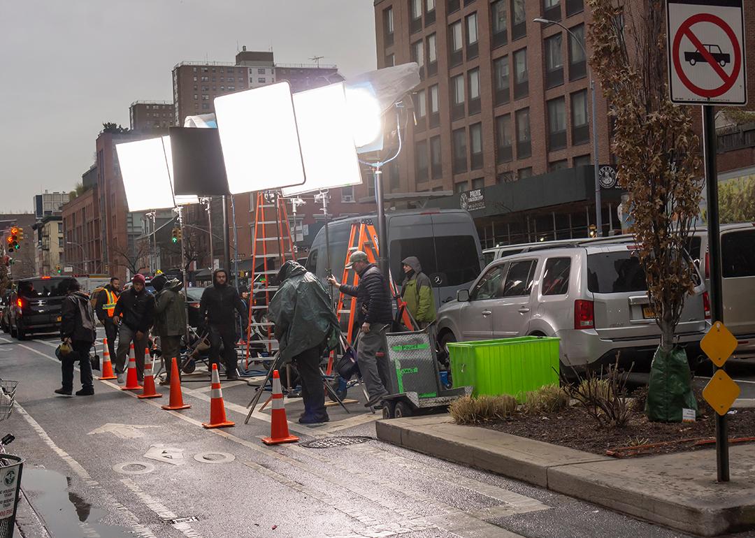 Lights and crew men during a filmmaking in Chelsea neighborhood, New York, USA.