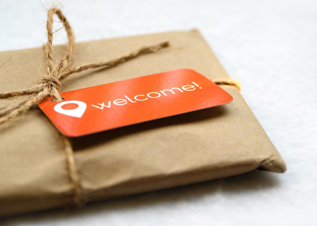A brown package with an orange welcome tag.