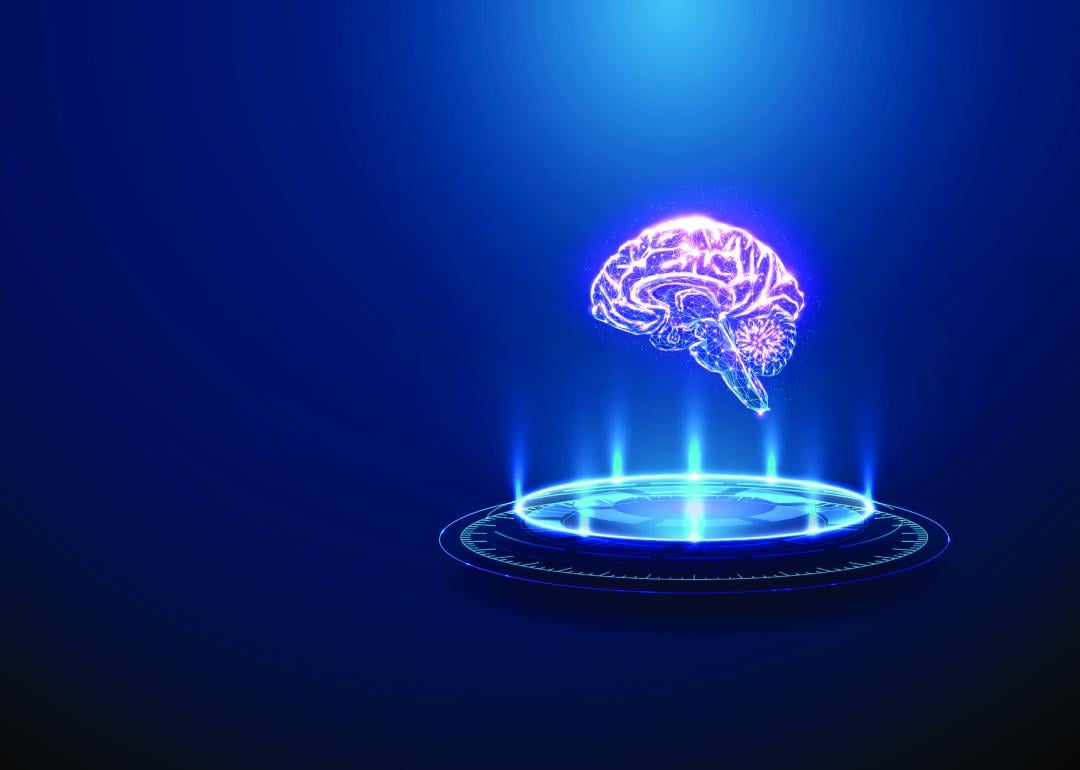 A 3D graphic image of a human brain with neon light beams in a podium.