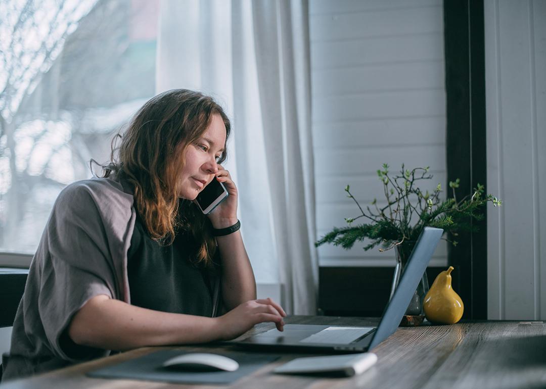 A person using a laptop and working from home. 