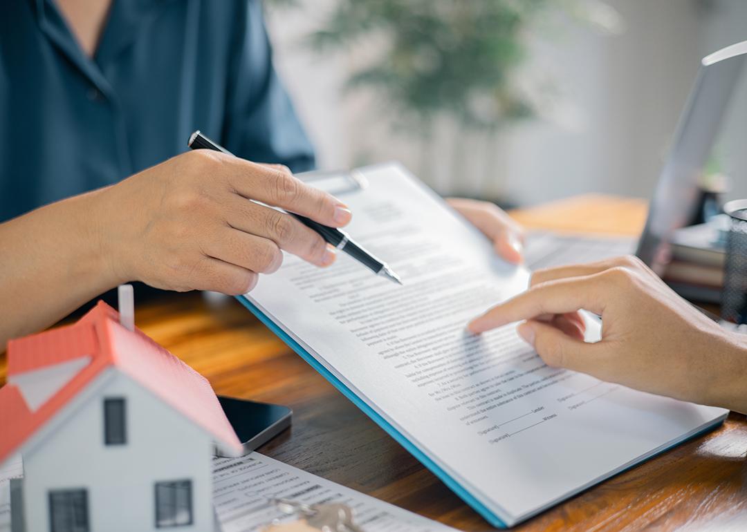 Broker showing a client a contract.