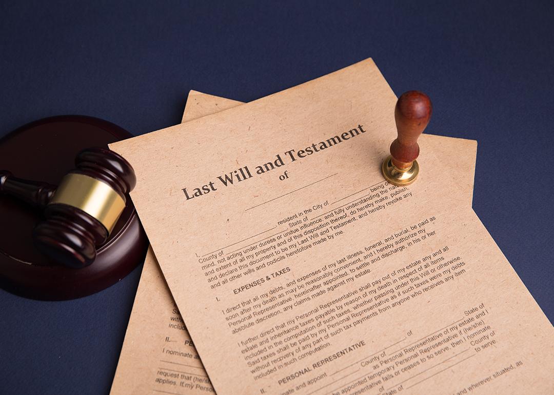 A notary's public pen and stamp on a last will and testament.