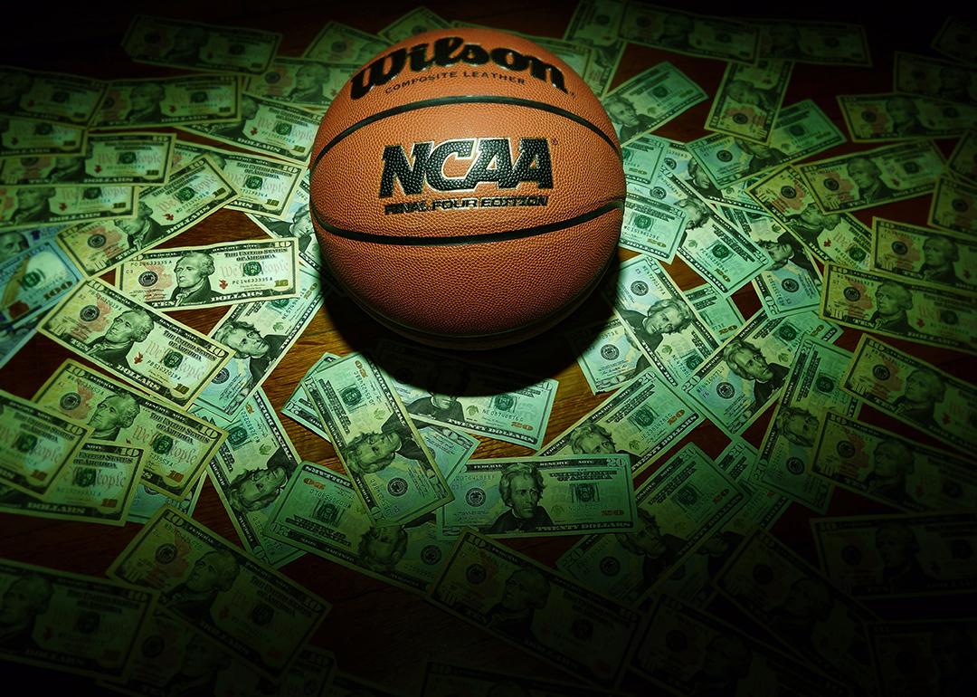 An NCAA Final Four Edition basketball surrounded by banknotes.