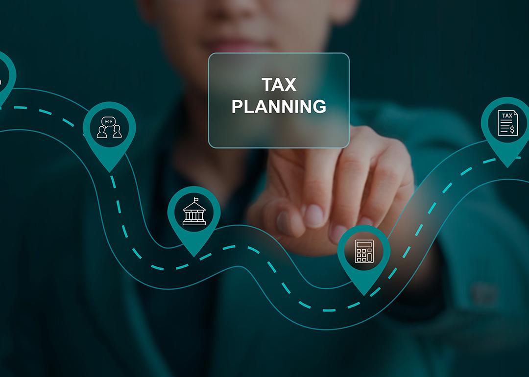Person pointing at a tax planning graphic.