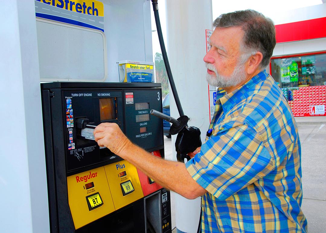 A man pays for gas at a station with credit card.