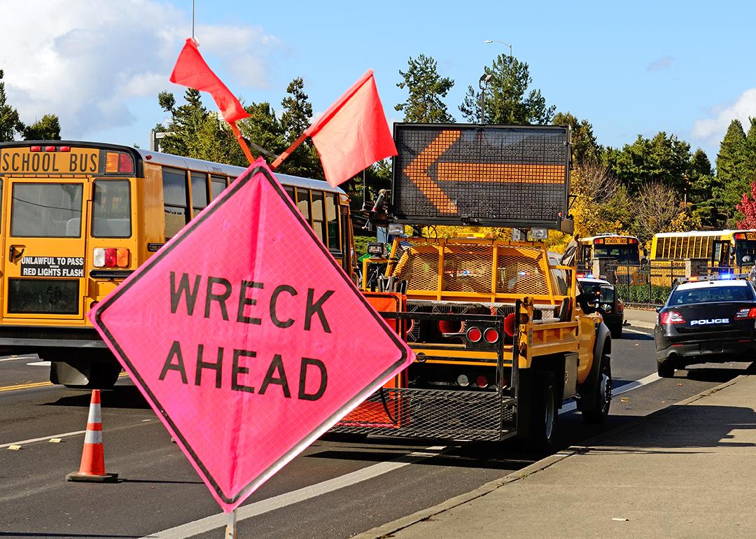 A 'wreck ahead' sign at a truck rollover accident.