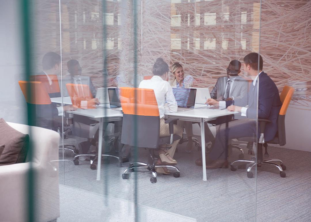 A group of business people during a meeting from a modern office.