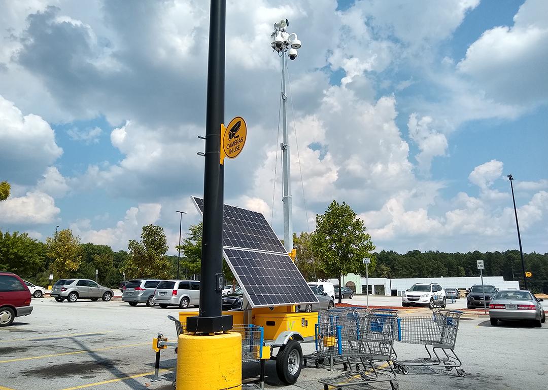 A solar powered surveillance system in a shop's parking lot in Atlanta, Georgia.