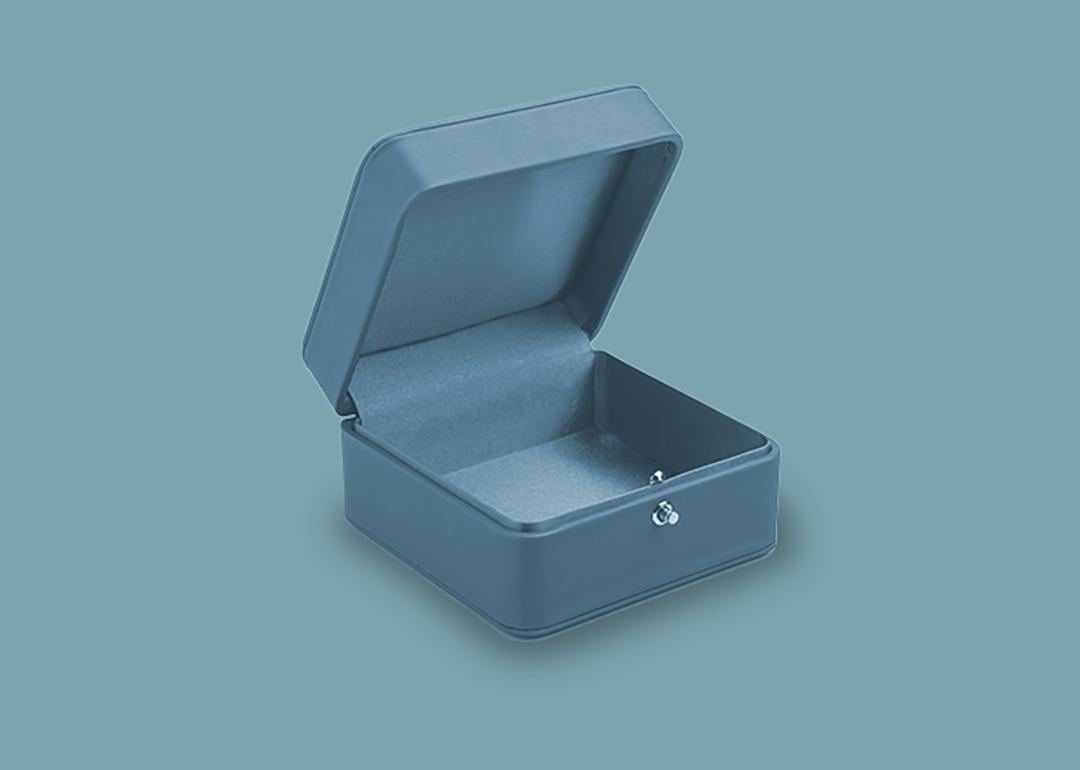An empty teal jewelry box.
