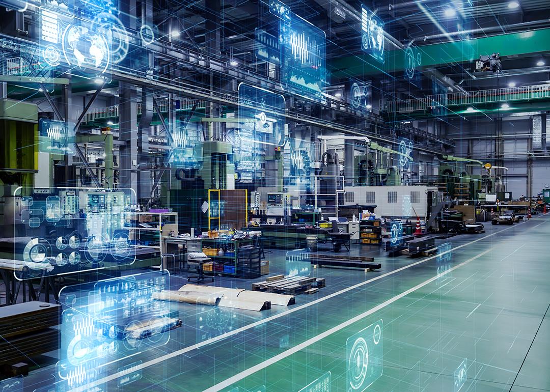 Large digital machines and tools inside a manufacturing warehouse.