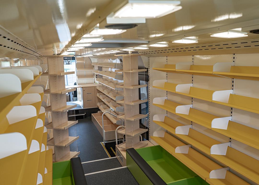 Interior of a modern bus converted into a small library.