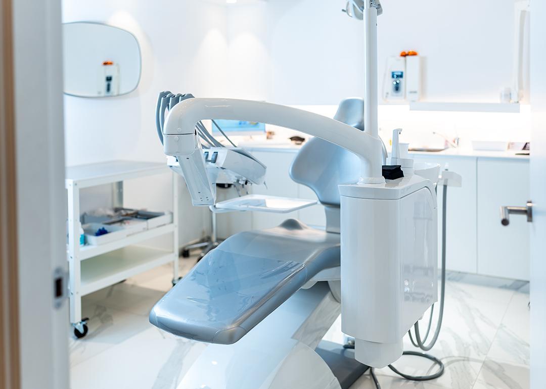 An empty dental patient's chair in a modern dental clinic.