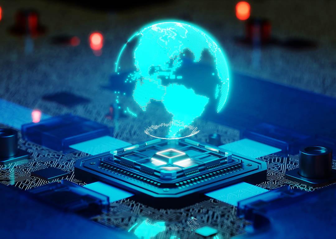Holographic illustration of the globe over a quantum processor chip.