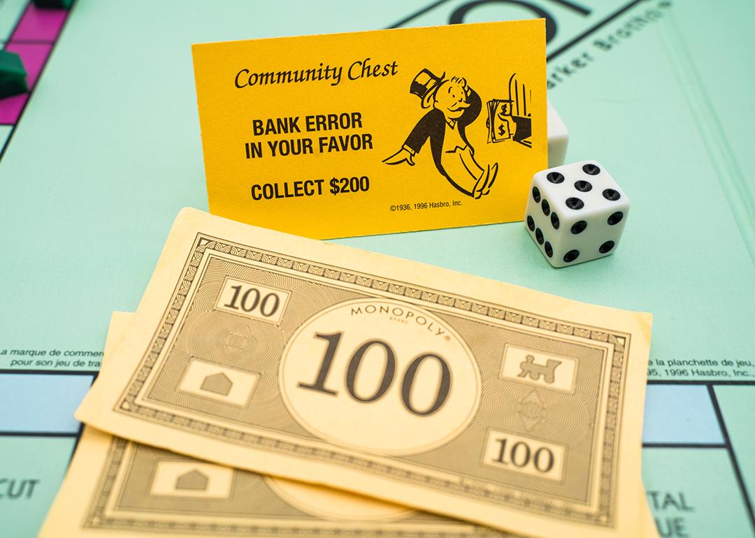 Banknotes and a bank error card from the Monopoly board game.