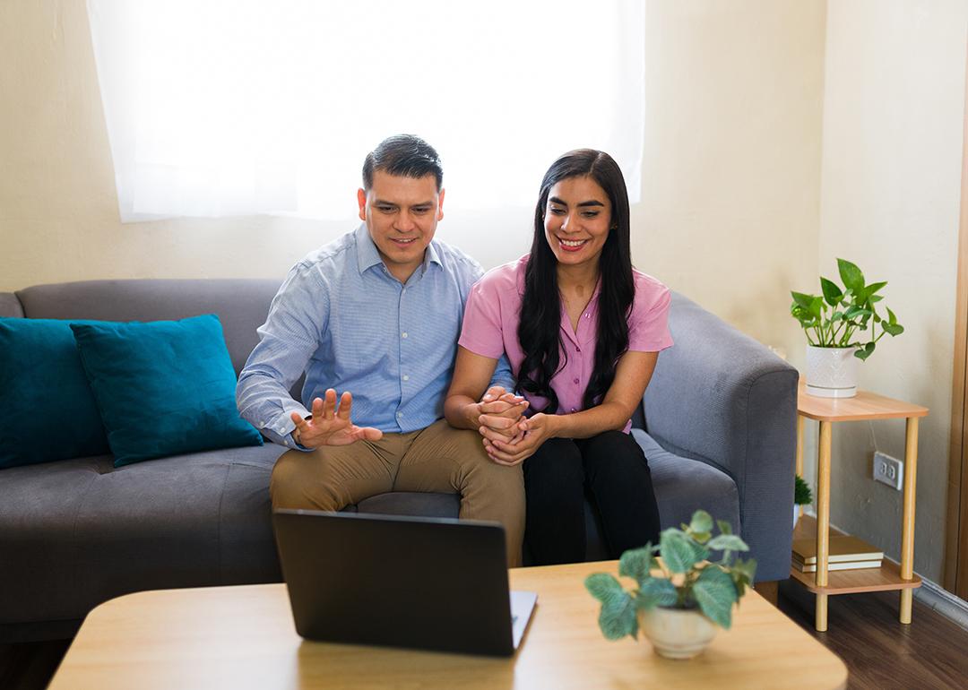 A couple at home attending a virtual therapy session.