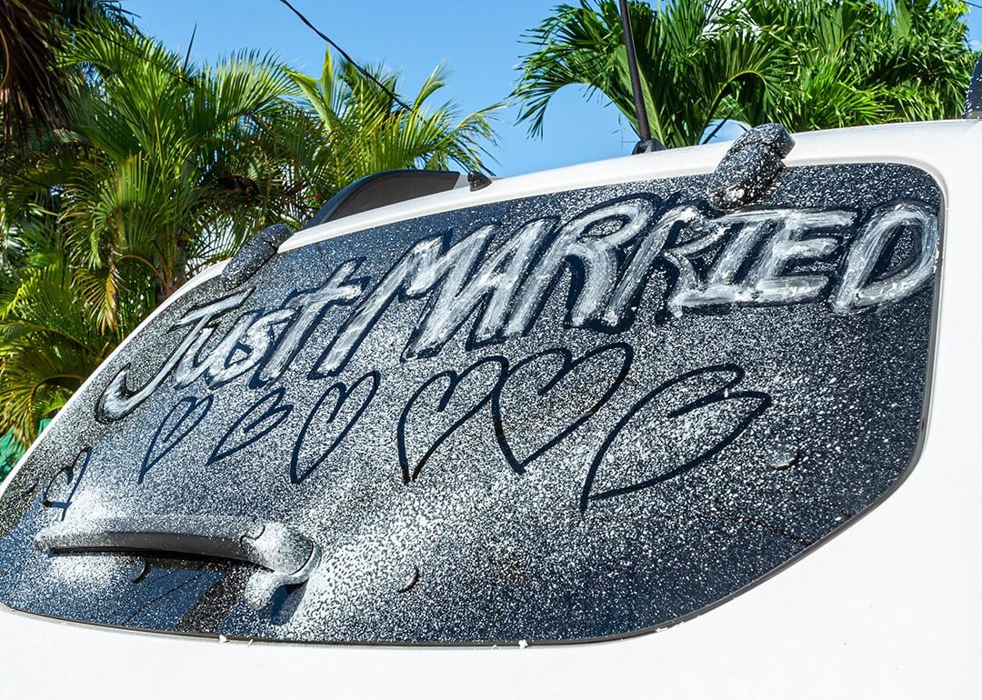'Just married' written on a car window.