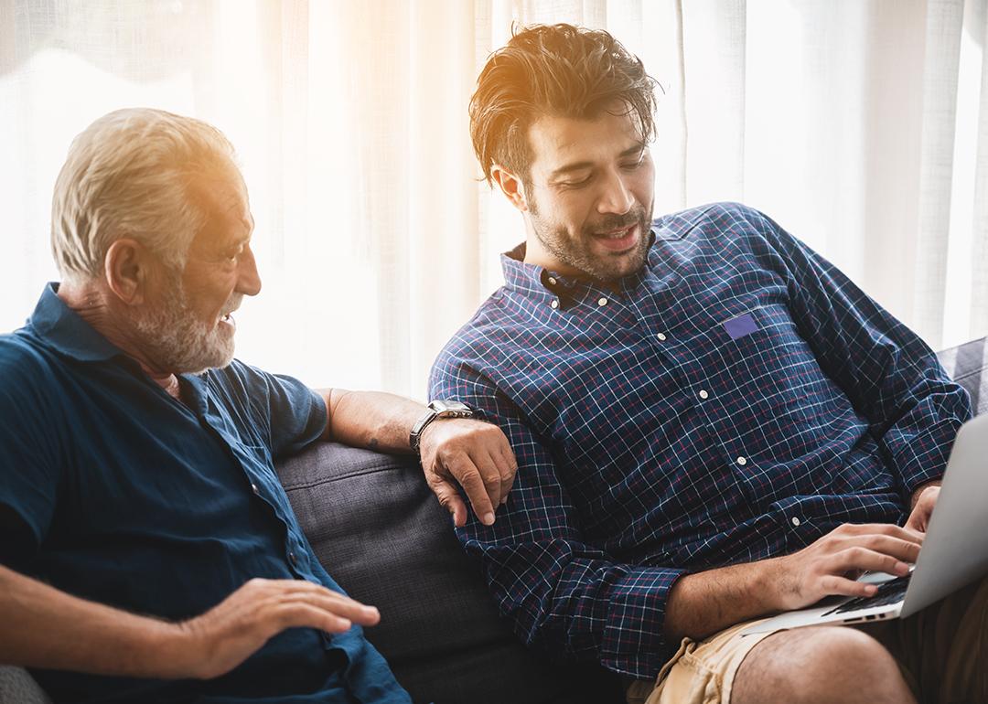 A senior father with his adult son discussing matters at home.