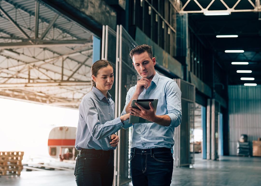 Warehouse managers checking logistic systems at work.