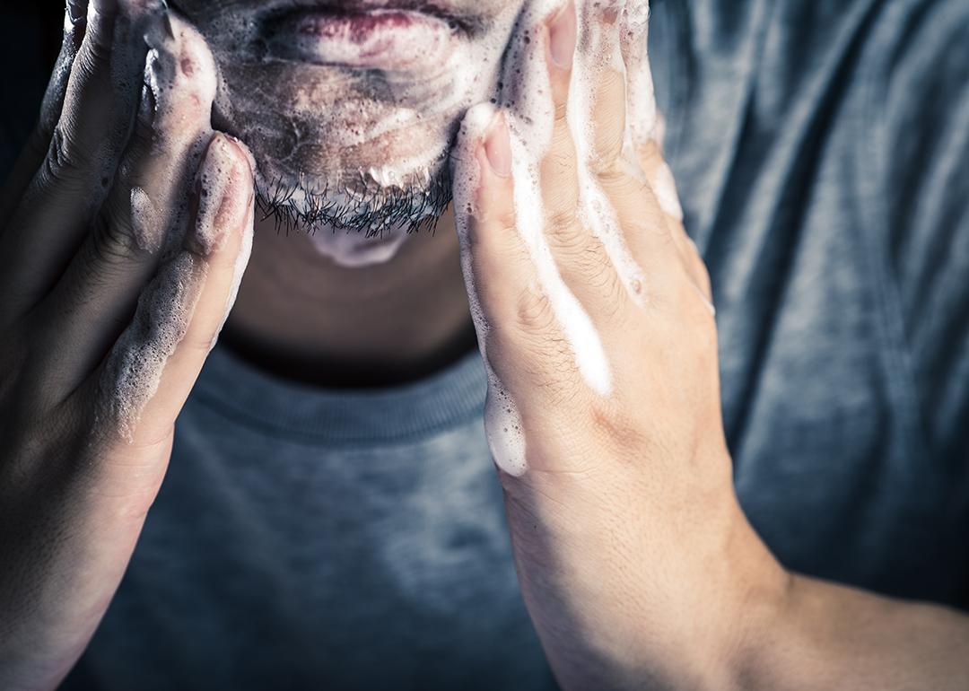 A man washing his face.