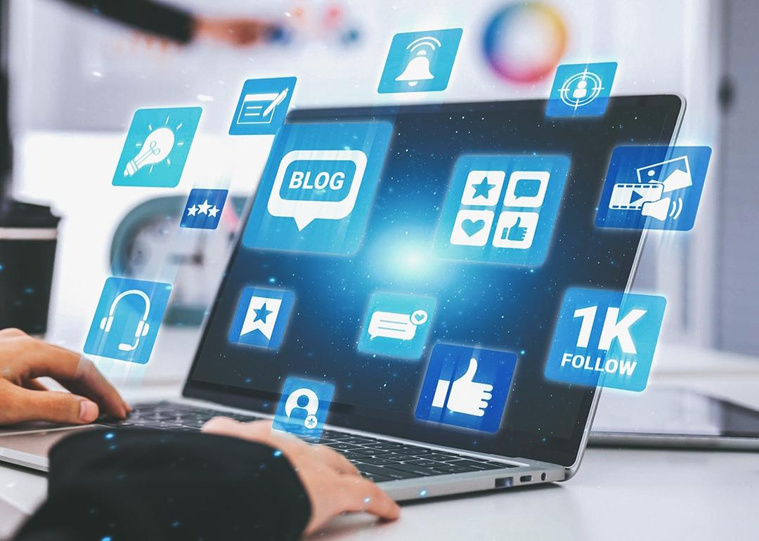 Blogging and engagement graphics illustrated over a laptop.