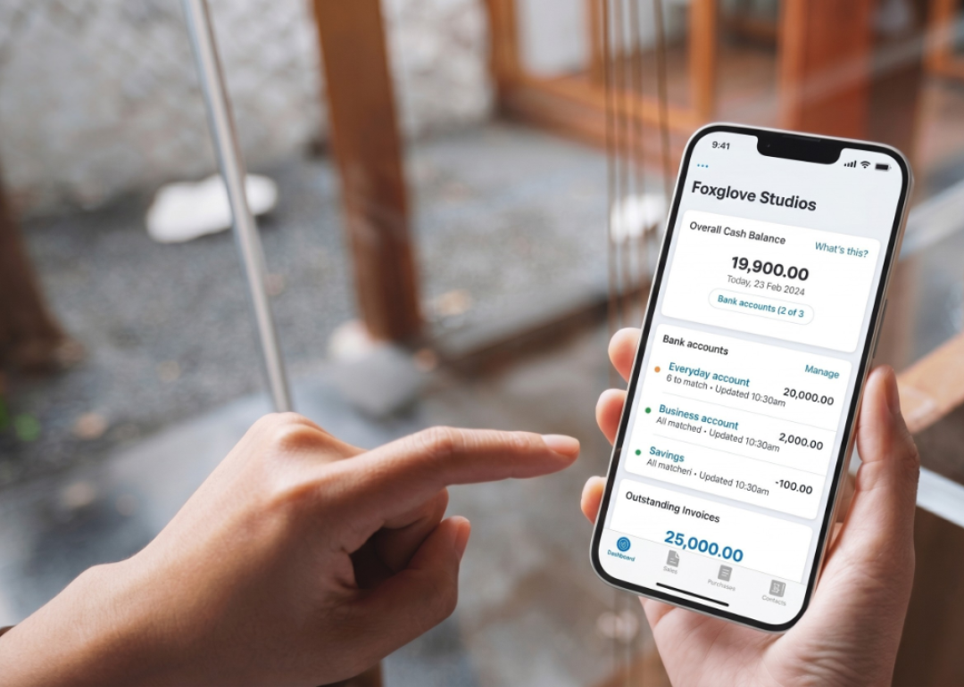 A user's phone displaying cash flow management app.