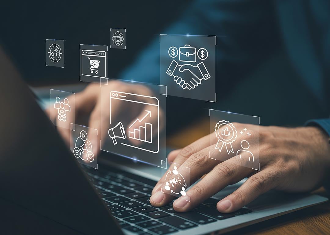 Businessman navigating a system illustrated with virtual marketing automation graphics.