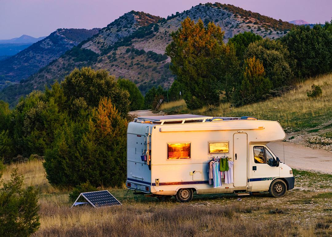 A motorhome recreational vehicle (RV) parked in a mountain for a holiday camping.