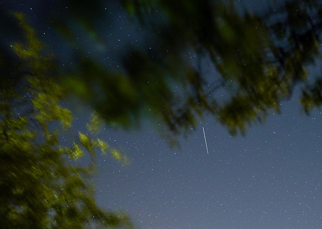 A satellite from a larger group of satellites called Starlink seen trailing across the night sky.