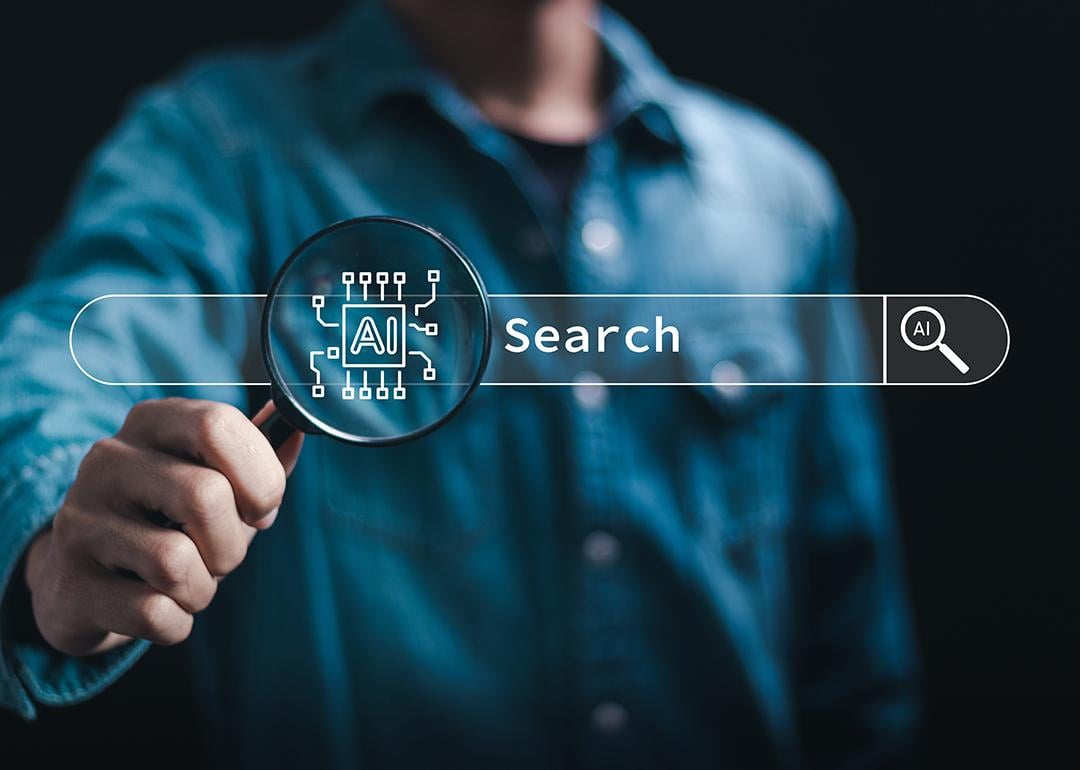 An artificial intelligence (AI) search technology and a data analyst holding a magnifying glass in the background.