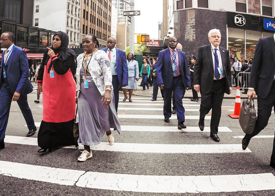 New Yorkers crossing the street to go to work in the morning.